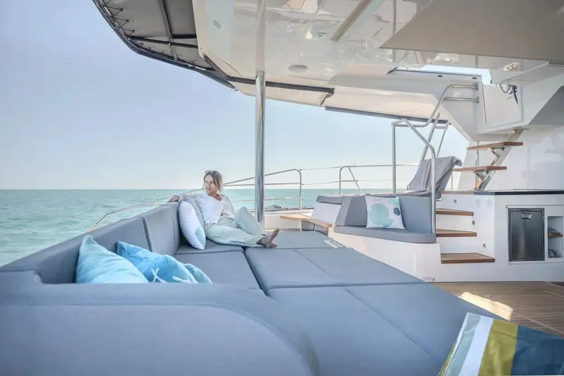  Yacht Photos Pics Luxury yacht Privilege Signature 650, 2027 model, with elegant outdoor seating and ocean view.