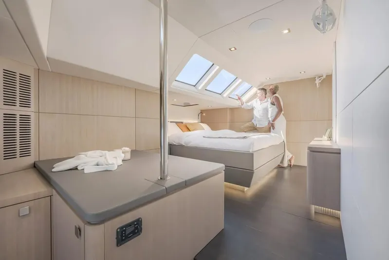  Yacht Photos Pics Luxurious cabin interior of 2027 Privilege Signature 650 yacht with skylight and modern design.