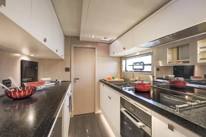  Yacht Photos Pics Modern kitchen interior on Privilege Signature 650 yacht, featuring sleek countertops and contemporary appliances.