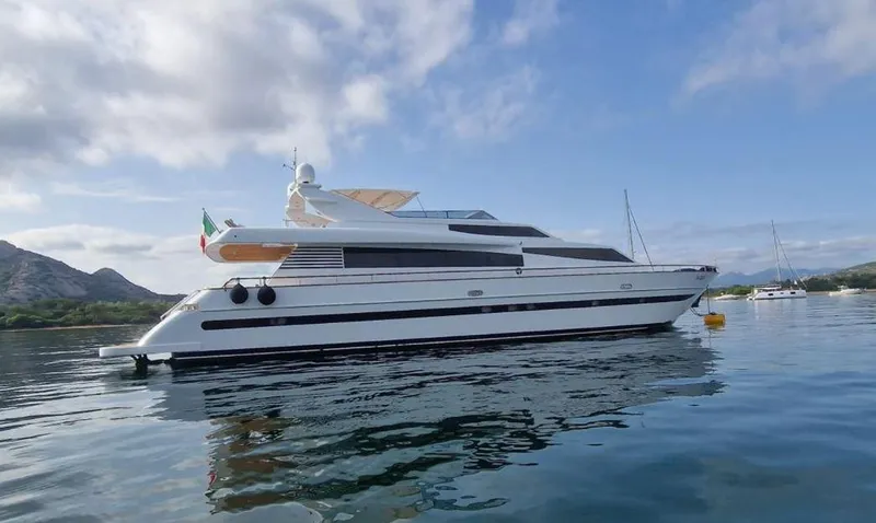 Toi Moi Et Roby Yacht Photos Pics Luxurious 2008 Diano 29 yacht on calm waters, with scenic mountain backdrop.