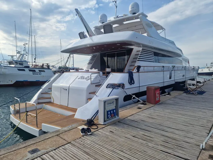 Toi Moi Et Roby Yacht Photos Pics Luxurious 2008 Diano 29 yacht docked at a marina under a partly cloudy sky.