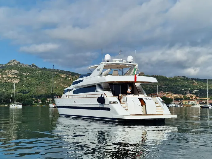 Toi Moi Et Roby Yacht Photos Pics Luxury yacht Diano 29, 2008 model, anchored in scenic coastal waters.