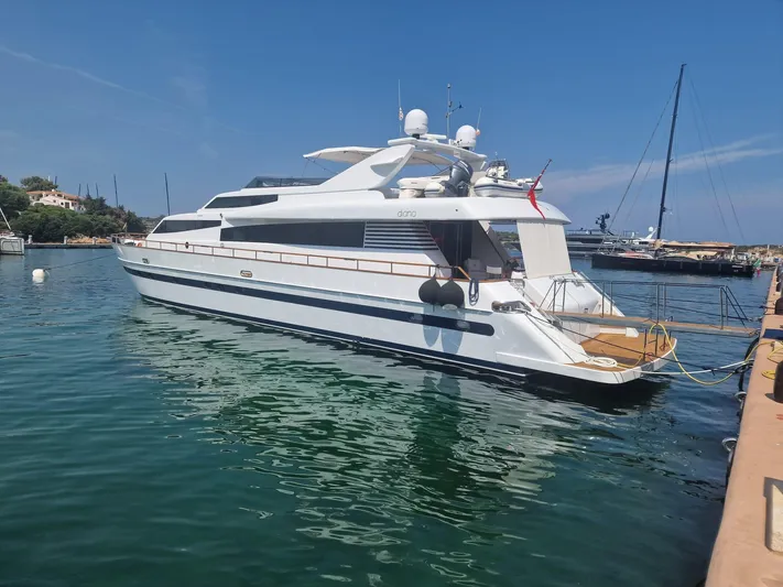 Toi Moi Et Roby Yacht Photos Pics Luxury yacht Diano 29, 2008 model, docked in a serene marina setting.