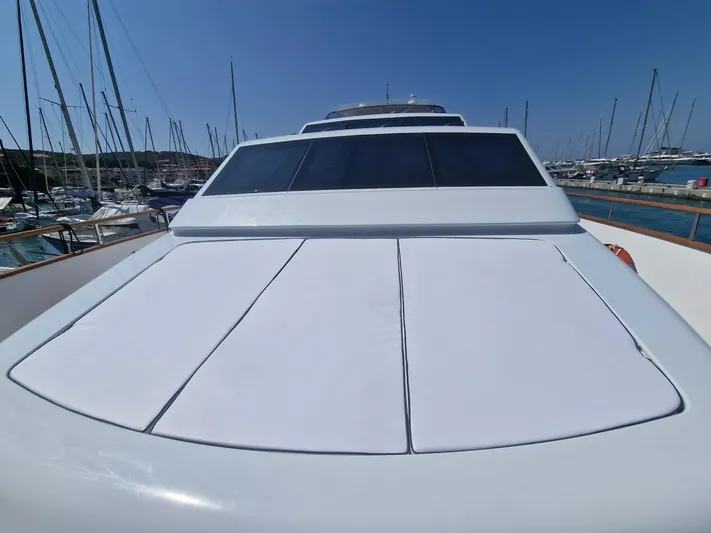 Toi Moi Et Roby Yacht Photos Pics Luxury yacht Diano 29, 2008 model, docked in a marina under clear blue skies.