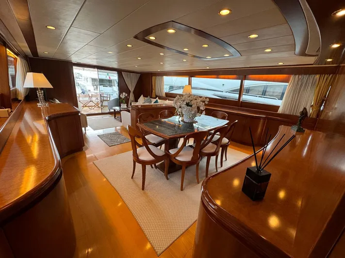 Toi Moi Et Roby Yacht Photos Pics Luxurious interior of 2008 Diano 29 yacht with elegant dining area and wooden finishes.