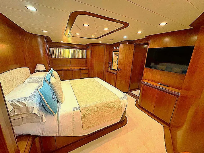 Toi Moi Et Roby Yacht Photos Pics Luxurious bedroom interior on 2008 Diano 29 yacht with wood paneling and modern amenities.