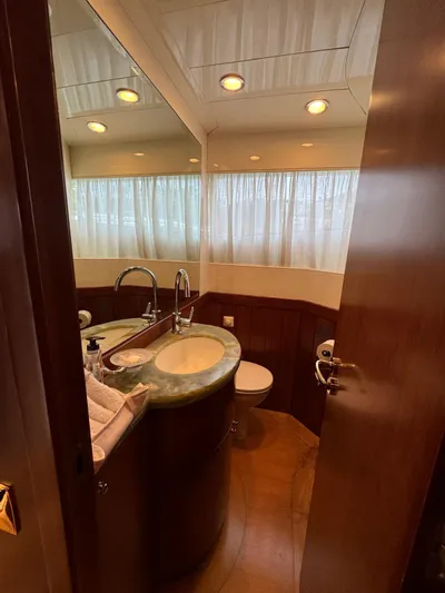 Toi Moi Et Roby Yacht Photos Pics Luxurious bathroom on 2008 Diano 29 yacht with elegant fixtures and natural lighting.