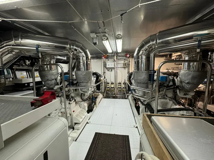 Toi Moi Et Roby Yacht Photos Pics Engine room of a 2008 Diano 29 yacht, featuring dual engines and metallic piping.