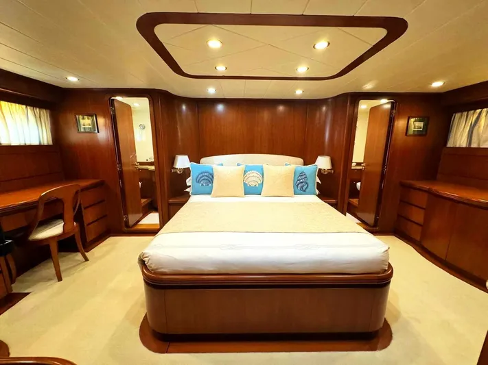 Toi Moi Et Roby Yacht Photos Pics Luxurious cabin interior of 2008 Diano 29 yacht with elegant wood finish and cozy bedding.