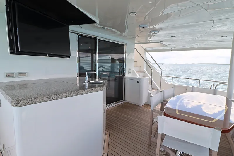  Yacht Photos Pics Luxurious 2013 Cheoy Lee Bravo yacht deck with dining area and ocean view.