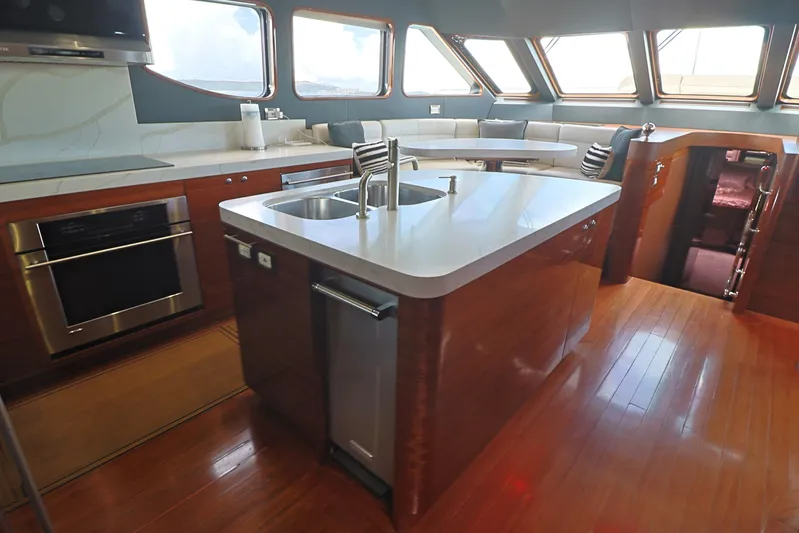  Yacht Photos Pics Luxurious Cheoy Lee Bravo 2013 yacht kitchen with modern appliances and sleek design.