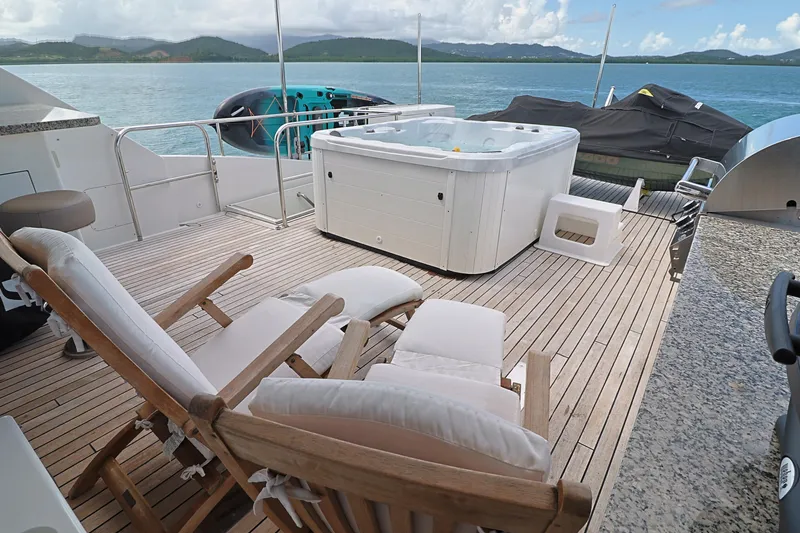  Yacht Photos Pics Luxury deck of 2013 Cheoy Lee Bravo yacht with hot tub and lounge chairs.