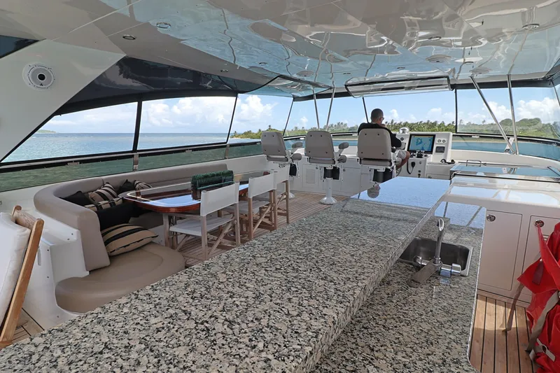  Yacht Photos Pics Luxurious 2013 Cheoy Lee Bravo yacht interior with granite countertop and ocean view.