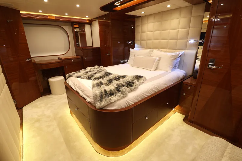  Yacht Photos Pics Luxurious 2013 Cheoy Lee Bravo yacht bedroom with elegant wood finishes and ambient lighting.