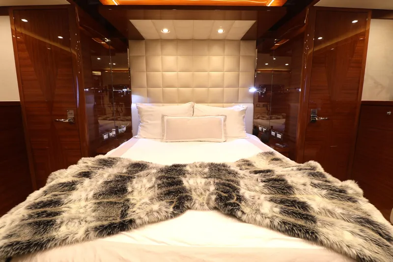  Yacht Photos Pics Luxurious bedroom interior on 2013 Cheoy Lee Bravo yacht with plush bedding and elegant wood finishes.