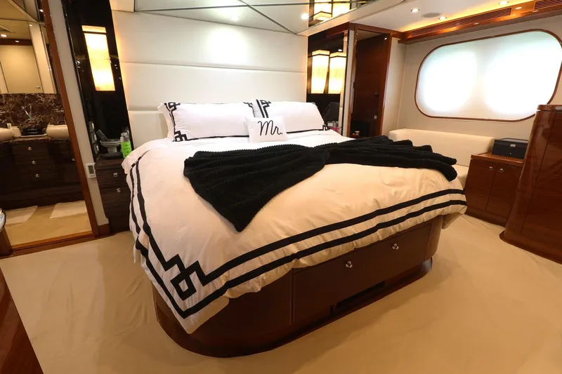  Yacht Photos Pics Luxurious bedroom interior of 2013 Cheoy Lee Bravo yacht with elegant bedding and ambient lighting.