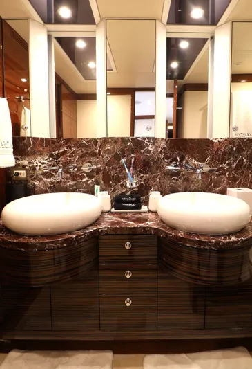  Yacht Photos Pics Luxurious bathroom in 2013 Cheoy Lee Bravo yacht with dual sinks and marble countertop.
