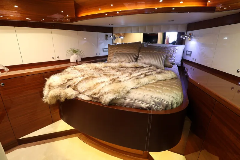  Yacht Photos Pics Luxurious bedroom interior of 2013 Cheoy Lee Bravo yacht with elegant bedding and wood finishes.