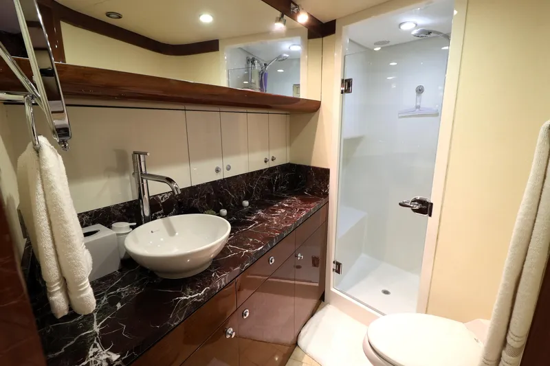  Yacht Photos Pics Luxurious bathroom in 2013 Cheoy Lee Bravo yacht with marble countertop and modern fixtures.