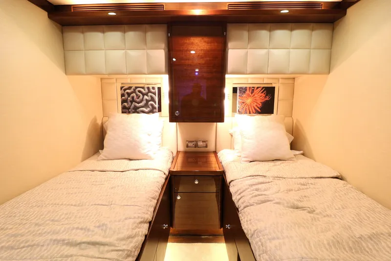  Yacht Photos Pics Luxurious twin cabin interior on 2013 Cheoy Lee Bravo yacht, featuring elegant bedding and ambient lighting.