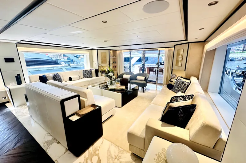 Optimism Yacht Photos Pics Luxurious interior of 2023 Majesty 120 yacht with elegant seating and modern decor.