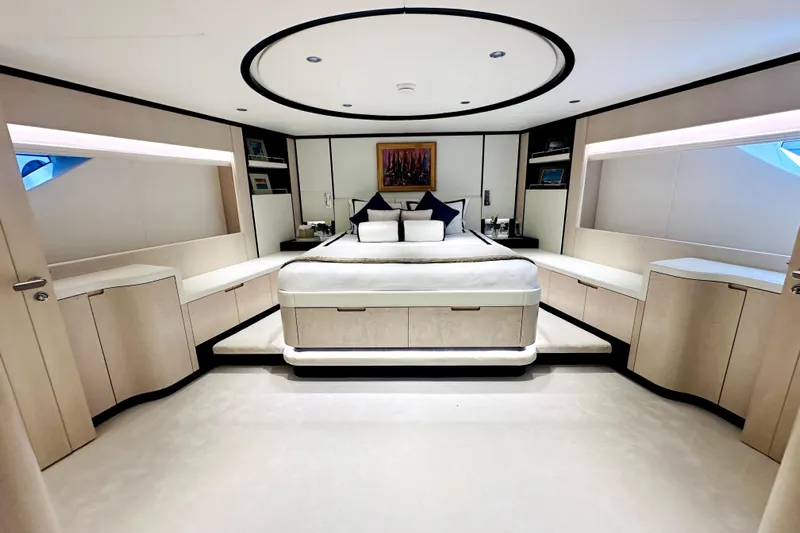 Optimism Yacht Photos Pics Luxurious 2023 Majesty 120 yacht bedroom with modern design and elegant furnishings.