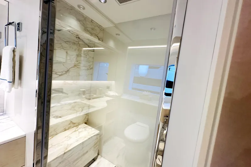 Optimism Yacht Photos Pics Luxurious bathroom with marble accents in 2023 Majesty 120 yacht.