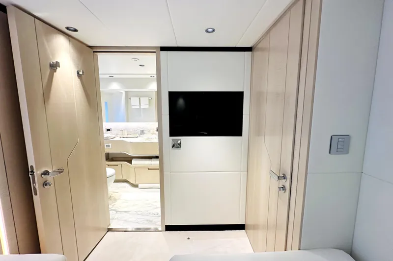 Optimism Yacht Photos Pics Luxurious interior of 2023 Majesty 120 yacht featuring modern bathroom and sleek design elements.