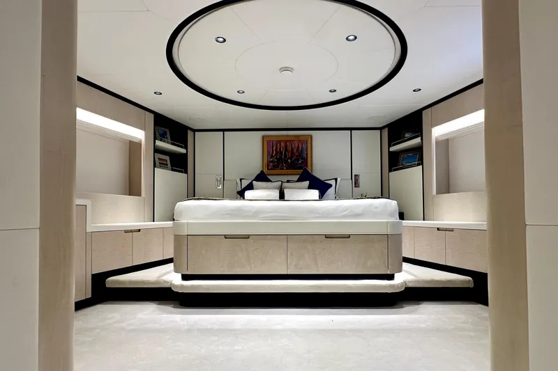 Optimism Yacht Photos Pics Luxurious bedroom interior of 2023 Majesty 120 yacht with modern design and elegant furnishings.