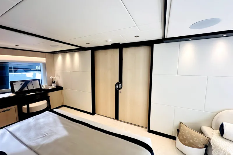 Optimism Yacht Photos Pics Luxurious 2023 Majesty 120 yacht bedroom with modern decor and elegant furnishings.