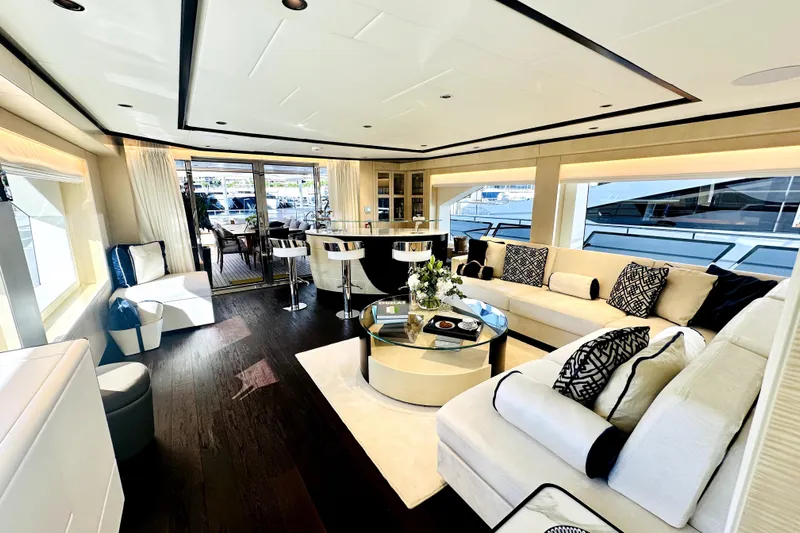 Optimism Yacht Photos Pics Luxurious interior of 2023 Majesty 120 yacht with elegant seating and modern decor.