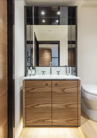 Absolute Navetta 64 Yacht Photos Pics Modern bathroom vanity in 2025 Absolute Navetta 64 yacht, featuring sleek wood cabinetry and mirrored accents.