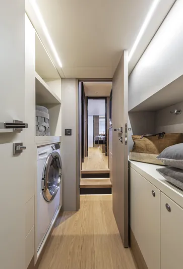 Absolute Navetta 64 Yacht Photos Pics Interior of 2025 Absolute Navetta 64 yacht, featuring laundry area and modern design.