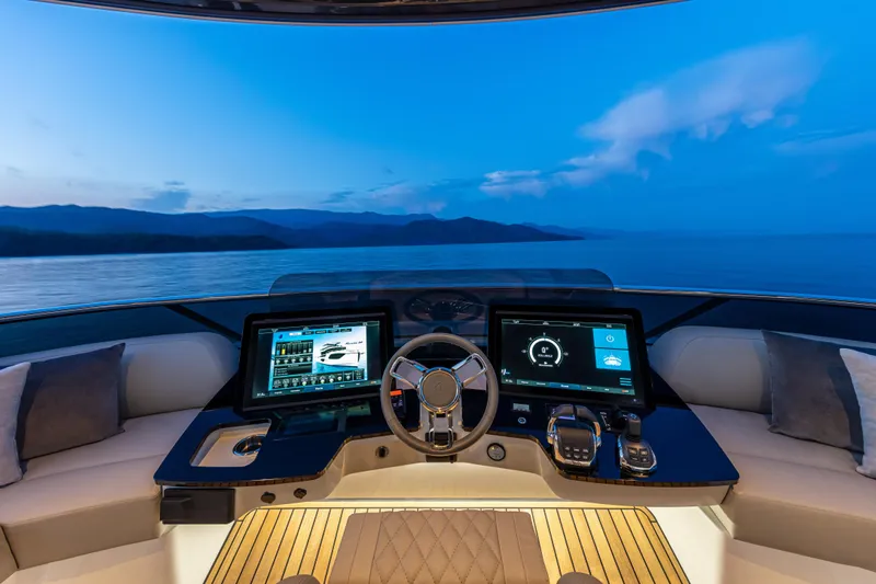 Absolute Navetta 64 Yacht Photos Pics Luxurious helm of 2025 Absolute Navetta 64 yacht with advanced navigation systems.
