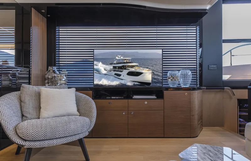 Absolute Navetta 64 Yacht Photos Pics Luxurious interior of 2025 Absolute Navetta 64 yacht with modern decor and comfortable seating.