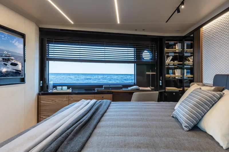Absolute Navetta 64 Yacht Photos Pics Luxurious bedroom interior of 2025 Absolute Navetta 64 yacht with ocean view.