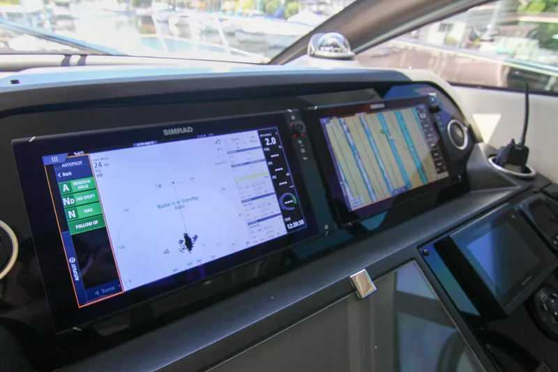  Yacht Photos Pics Control panel of a 2017 Sunseeker Predator 57 yacht with navigation displays.