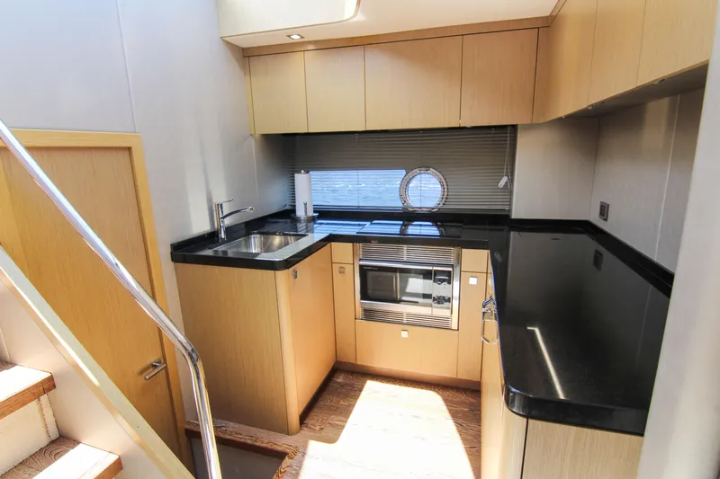  Yacht Photos Pics Luxurious kitchen interior of 2017 Sunseeker Predator 57 yacht with modern appliances.
