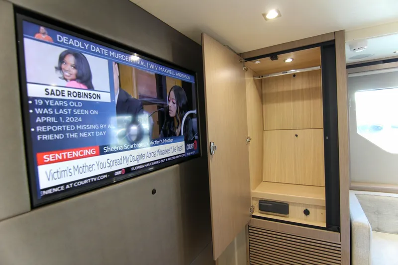  Yacht Photos Pics 2017 Sunseeker Predator 57 interior with TV and open cabinet.