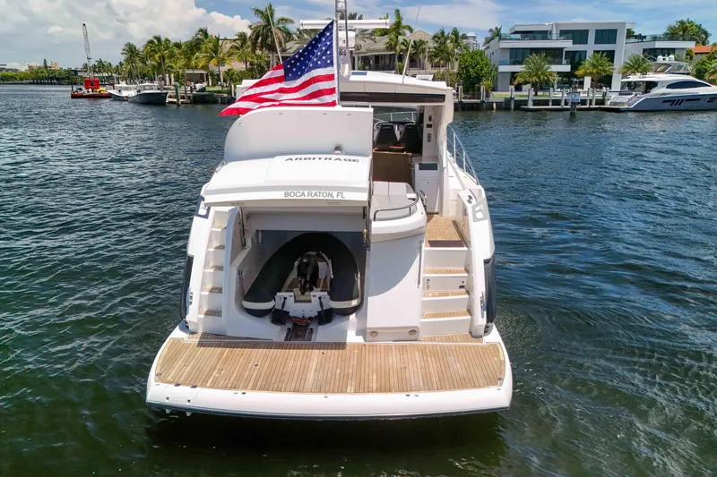  Yacht Photos Pics 2017 Sunseeker Predator 57 yacht with American flag, docked in Boca Raton, Florida.