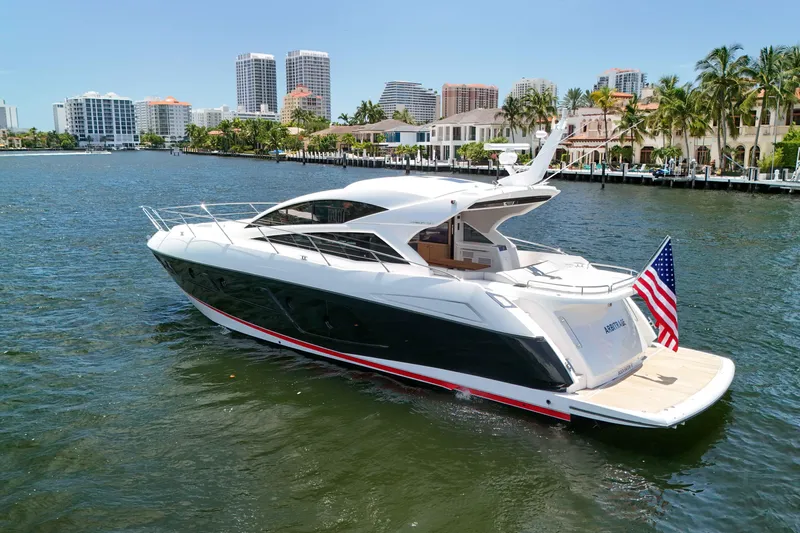  Yacht Photos Pics 2017 Sunseeker Predator 57 yacht cruising near waterfront cityscape.