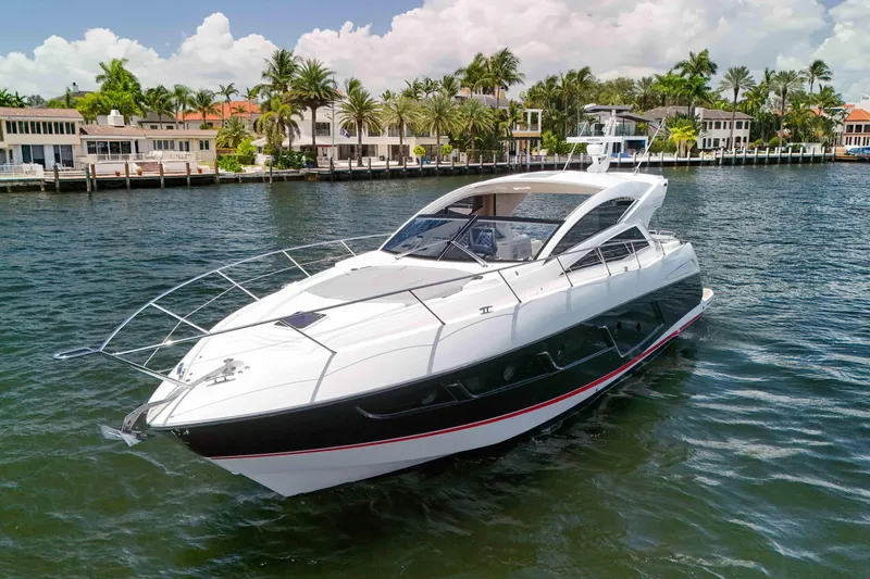  Yacht Photos Pics 2017 Sunseeker Predator 57 yacht cruising near luxury waterfront homes.