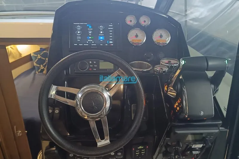  Yacht Photos Pics Cockpit of 2019 Jeanneau Merry Fisher 895 with steering wheel and control panel.