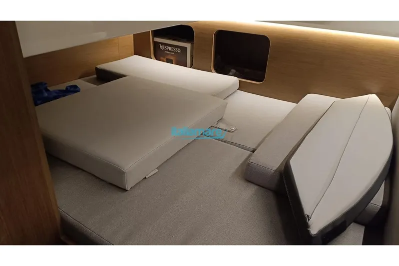  Yacht Photos Pics Interior of 2019 Jeanneau Merry Fisher 895 with cushioned seating.