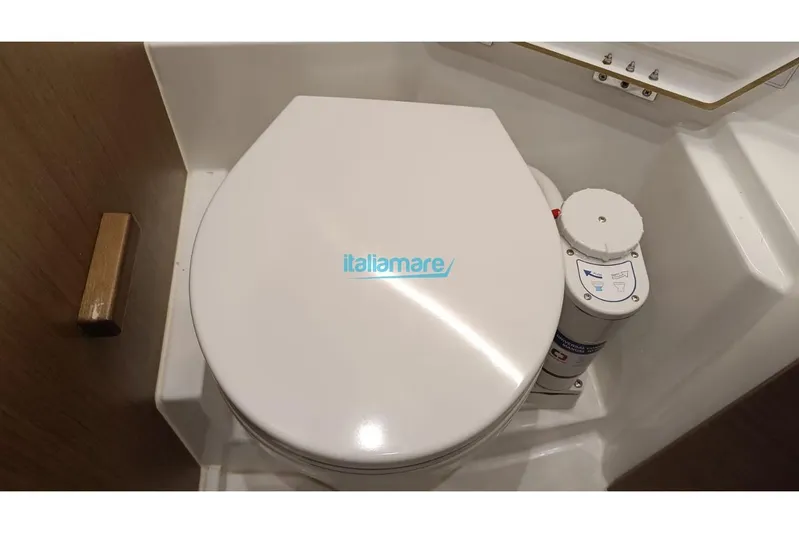  Yacht Photos Pics 2019 Jeanneau Merry Fisher 895 boat toilet with manual flush system.