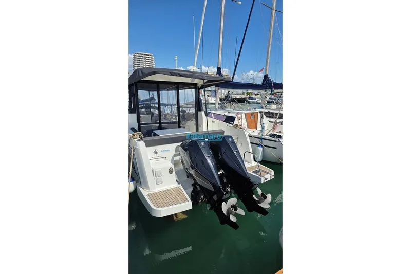  Yacht Photos Pics 2019 Jeanneau Merry Fisher 895 boat with dual outboard motors docked in marina.