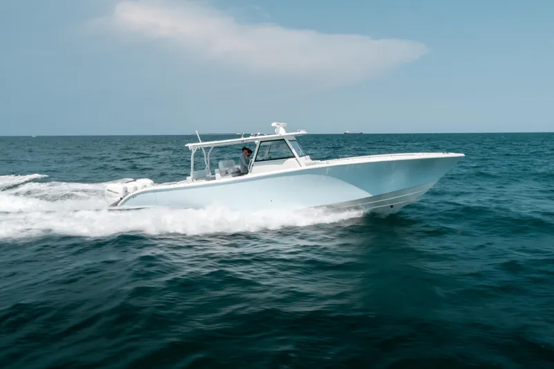  Yacht Photos Pics 2017 Yellowfin 42 boat cruising on open sea under clear sky.
