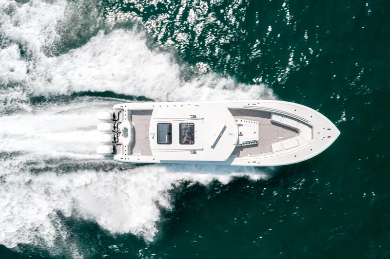  Yacht Photos Pics Aerial view of 2017 Yellowfin 42 boat speeding on the ocean.