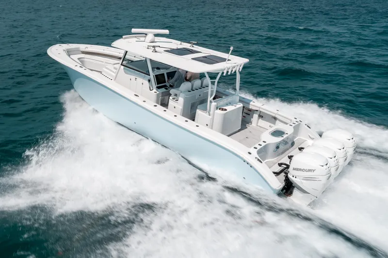  Yacht Photos Pics 2017 Yellowfin 42 boat cruising on open water, showcasing powerful engines and sleek design.