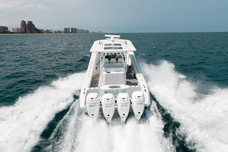  Yacht Photos Pics 2017 Yellowfin 42 boat cruising on open water with four powerful engines.